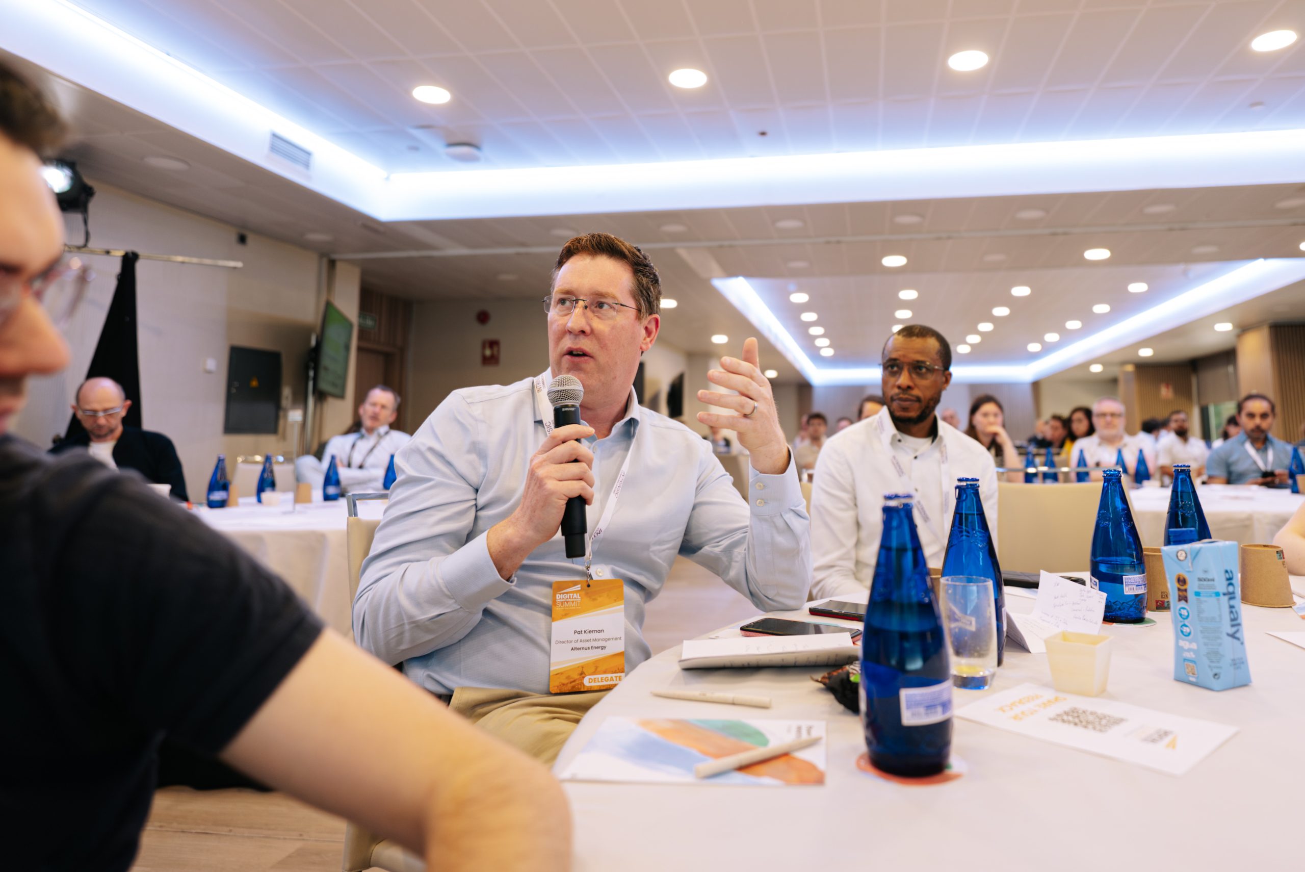 man asks question during presentation at Digital Power+grid Summt 2026